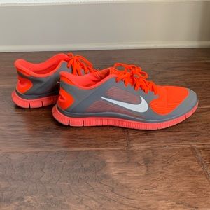 Neon Orange and Gray Nike run 4.0 size 10